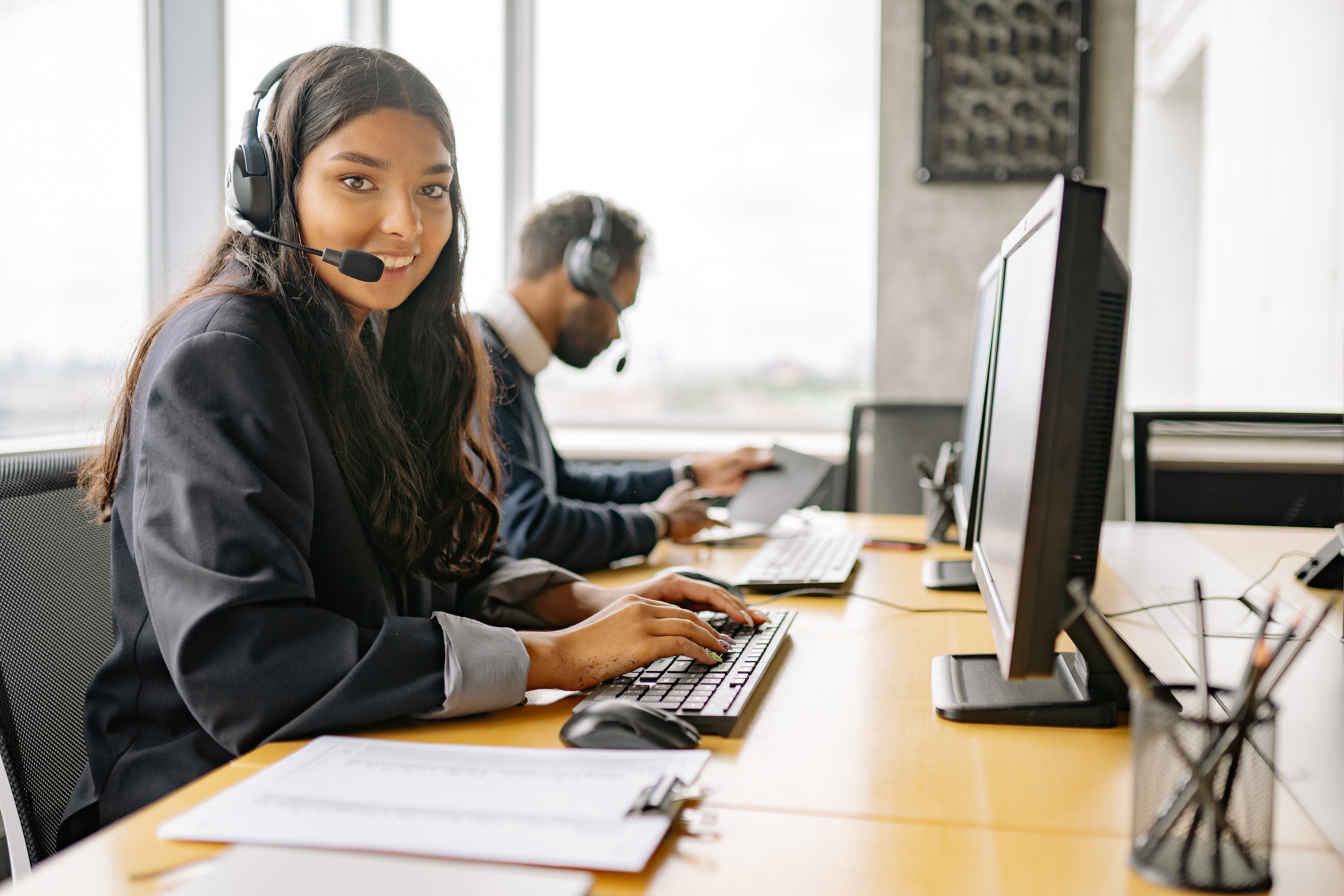 A call center agent smiling