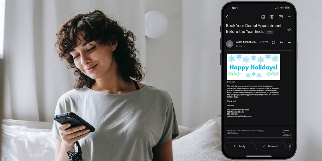Person using a smartphone and smiling. A graphic to the right-hand side of their head displays a smartphone with an email open on it. The email displays an example of an ABELDent-powered broadcast message reminding patients to book their outstanding dental appointment before the calendar year ends.